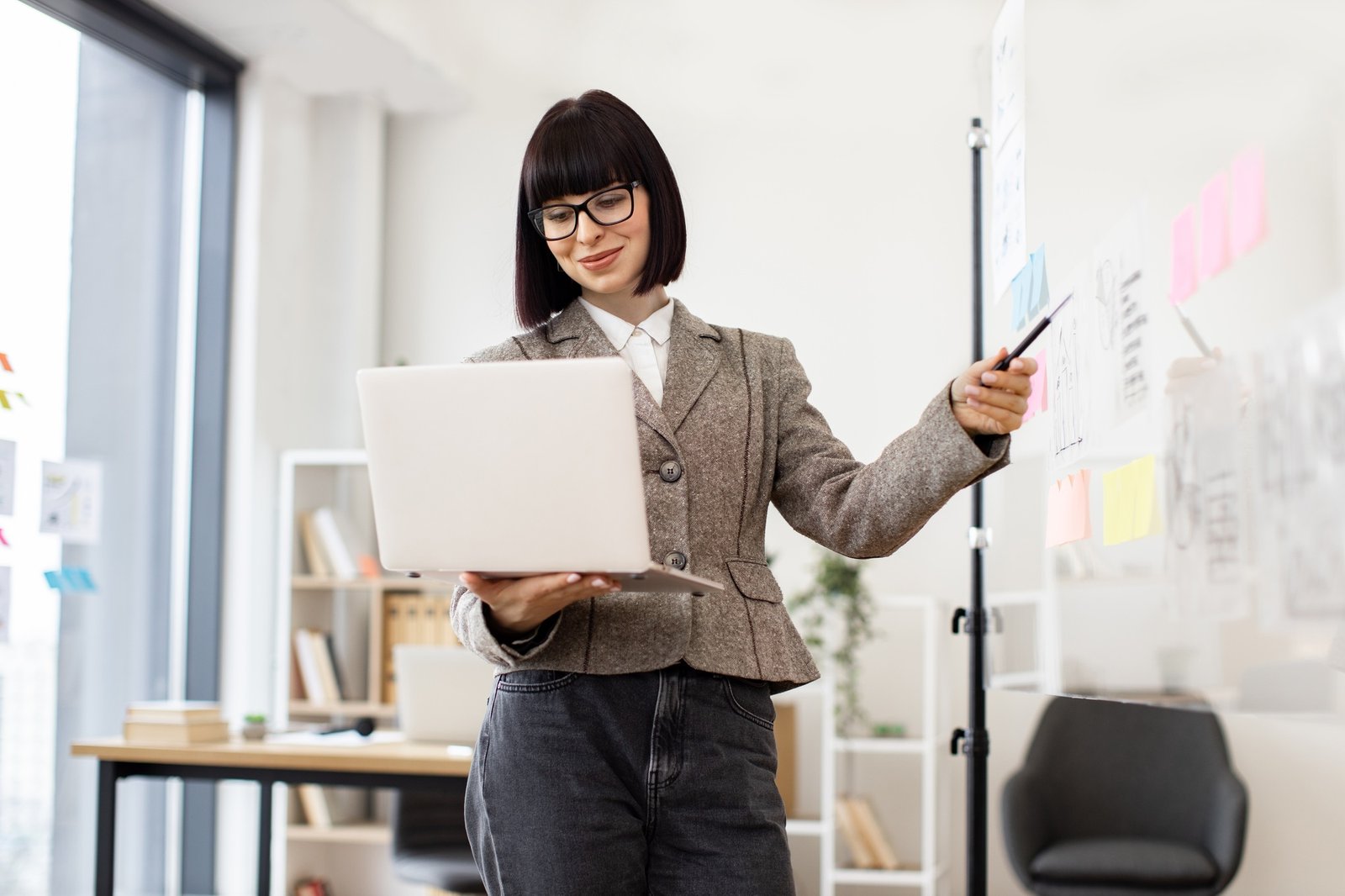 Female administrative manager preparing for presentation at work.
